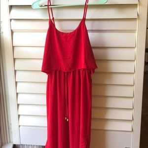 Red dress with details around the waste.